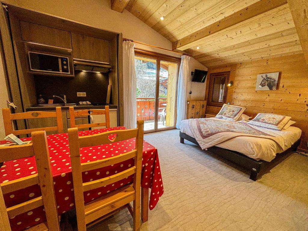 Postel nebo postele na pokoji v ubytování Hôtel Igloo