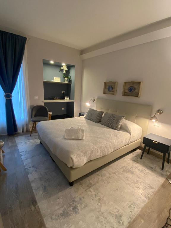 Postel nebo postele na pokoji v ubytování Hotel Il colle di Monterosso