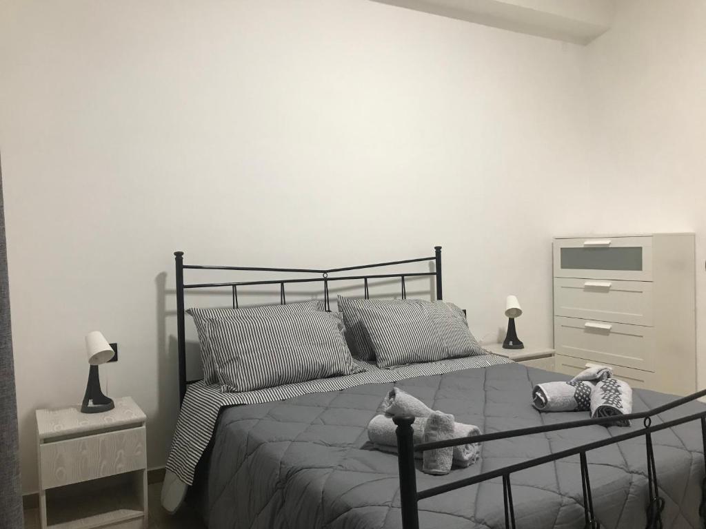 Tempat tidur dalam kamar di Ribera villa alloggio 2