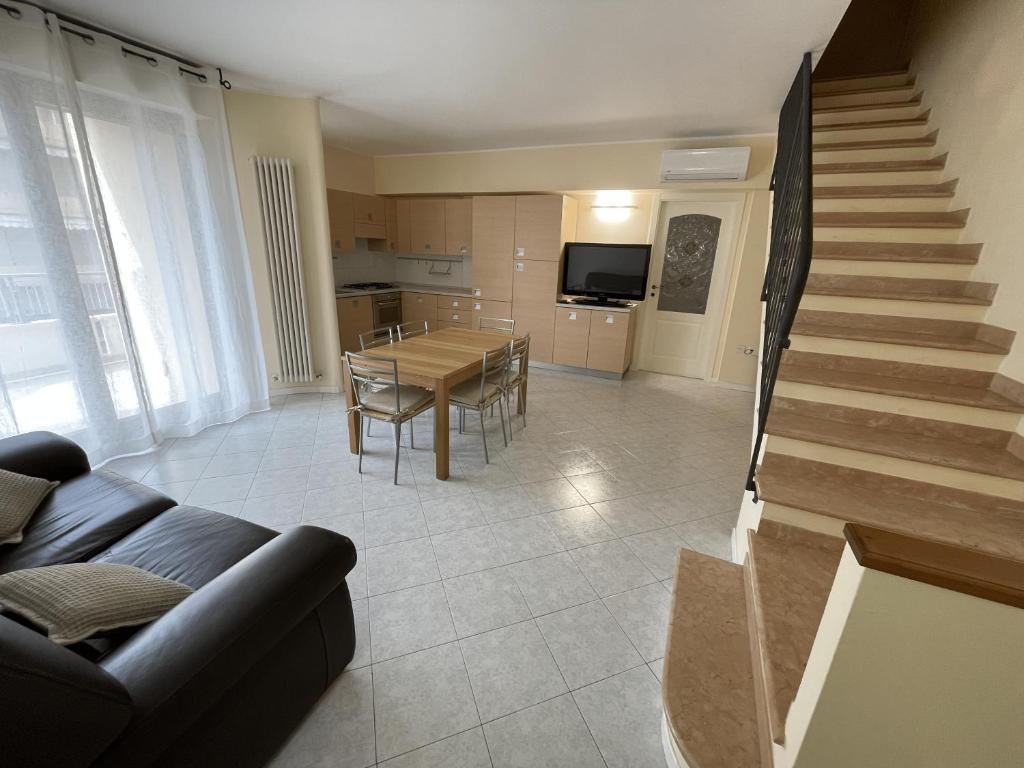 a living room with a couch and a table at Casa Giorgio in Fano