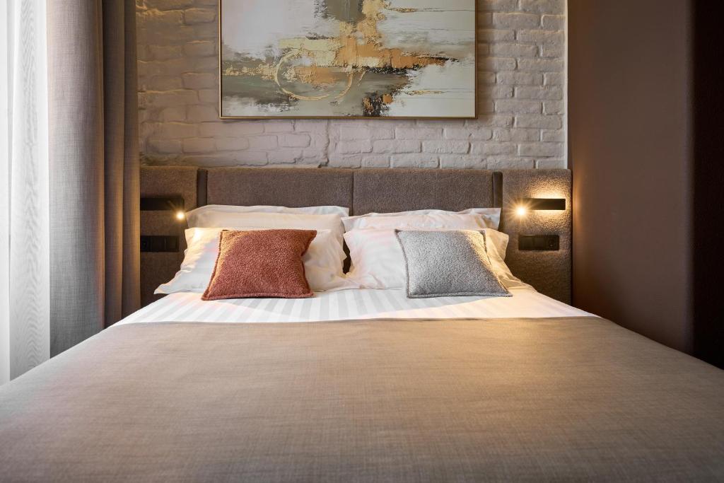 Postel nebo postele na pokoji v ubytování FIMKA Apart Hotel