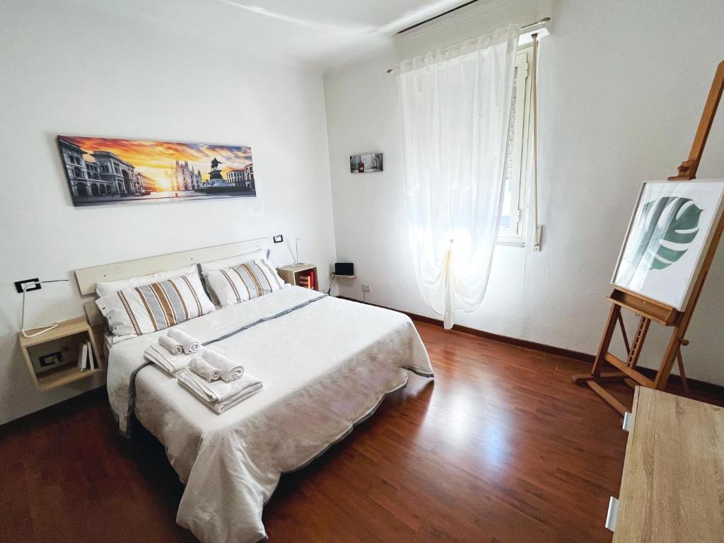 เตียงในห้องที่ Appartamento Città Giardino