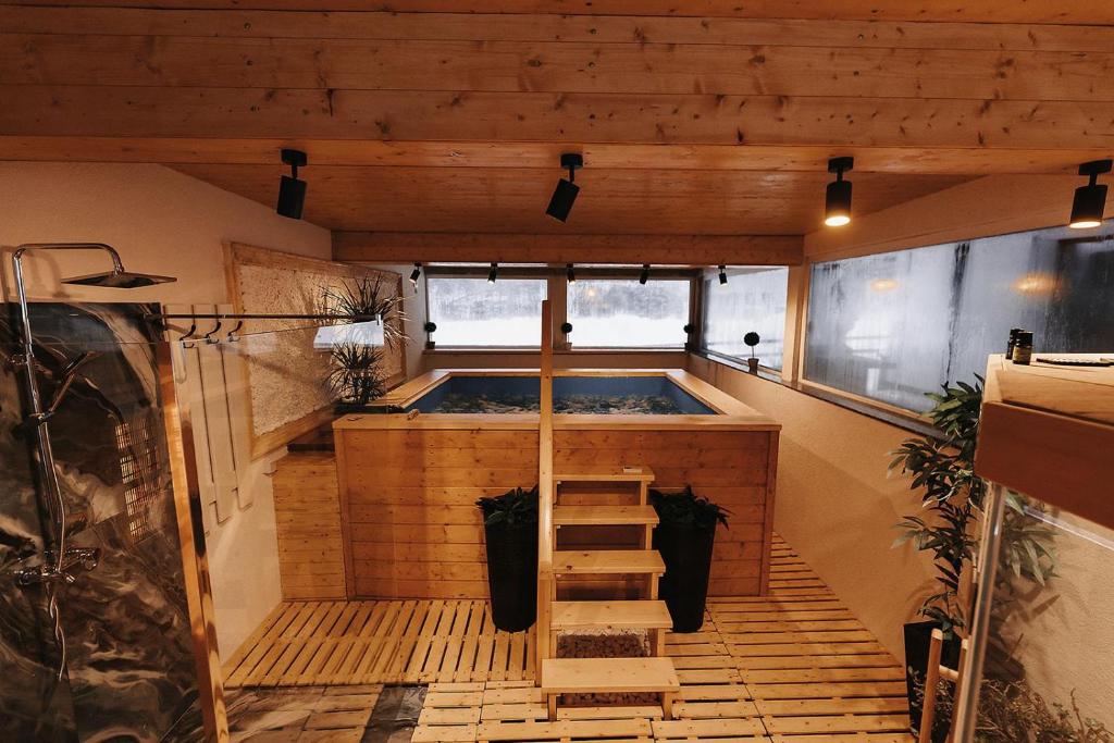 an indoor hot tub in a tiny house at Royal Alpin Crown in Cavnic
