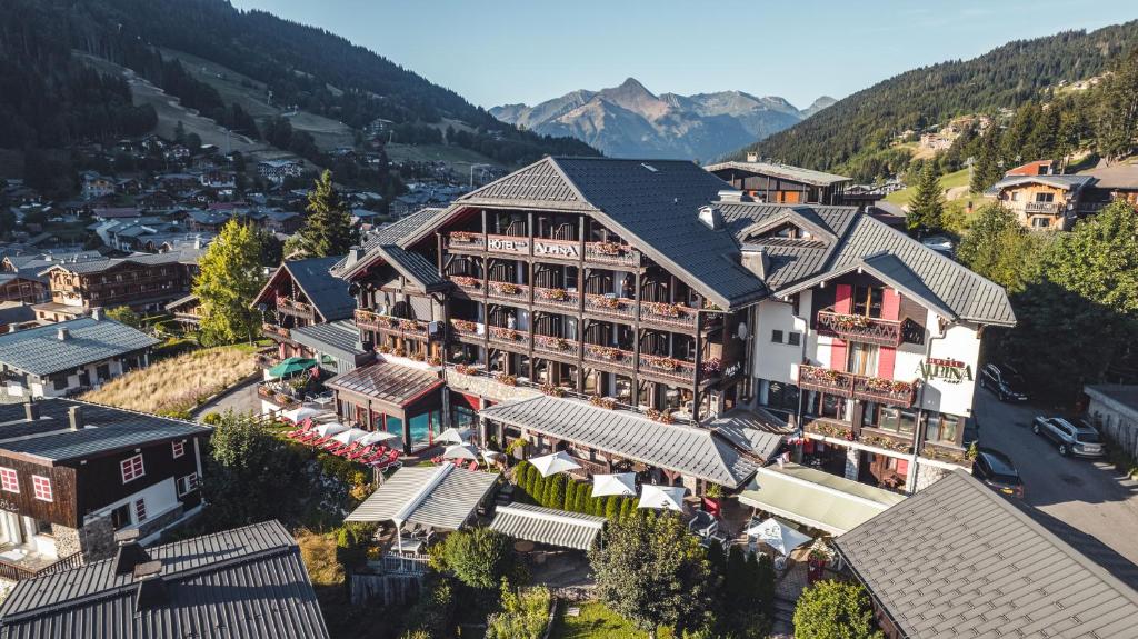 an aerial view of a hotel in the mountains at Hôtel Alpina & SPA in Les Gets