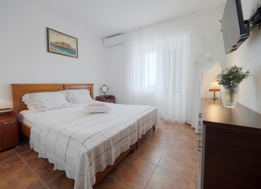 Postel nebo postele na pokoji v ubytování Casa Pastrovici del Mare