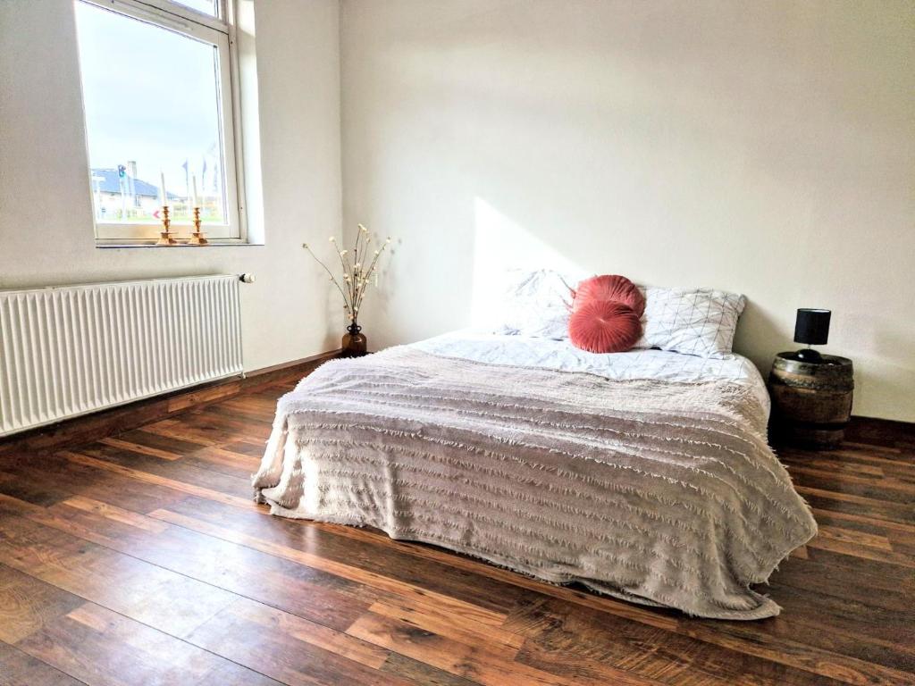 a bedroom with a bed with a teddy bear on it at Haus Fabjerg in Lemvig