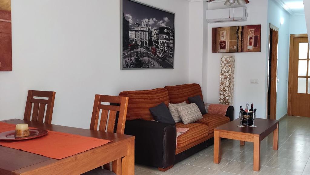 a living room with a couch and a table at CASA GARIJO - San Juan de los Terreros in San Juan de los Terreros