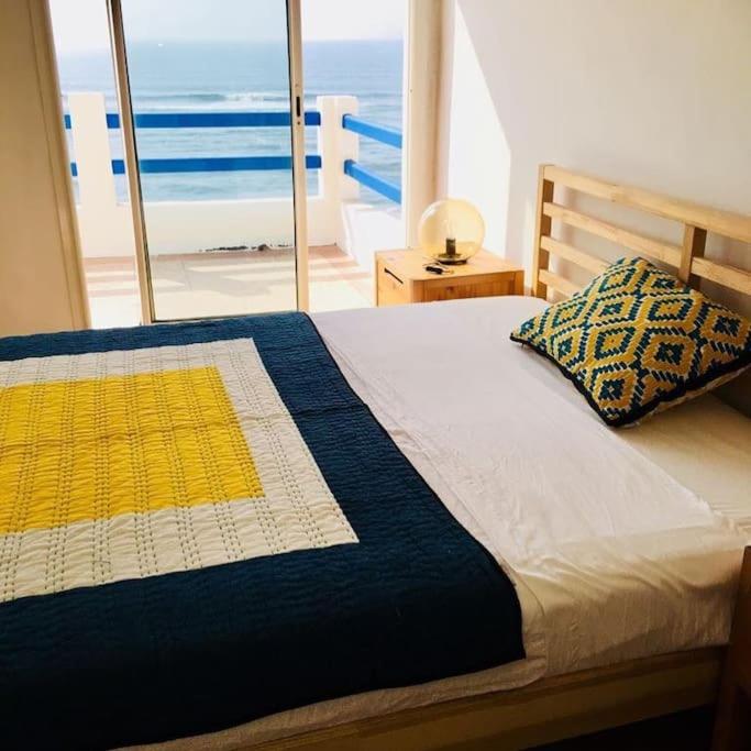 Postel nebo postele na pokoji v ubytování Villa vue imprenable sur l’Océan.