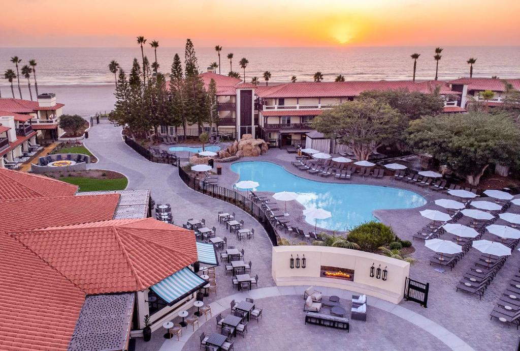 an aerial view of a resort with a swimming pool at Zachari Dunes on Mandalay Beach, Curio Collection by Hilton in Oxnard