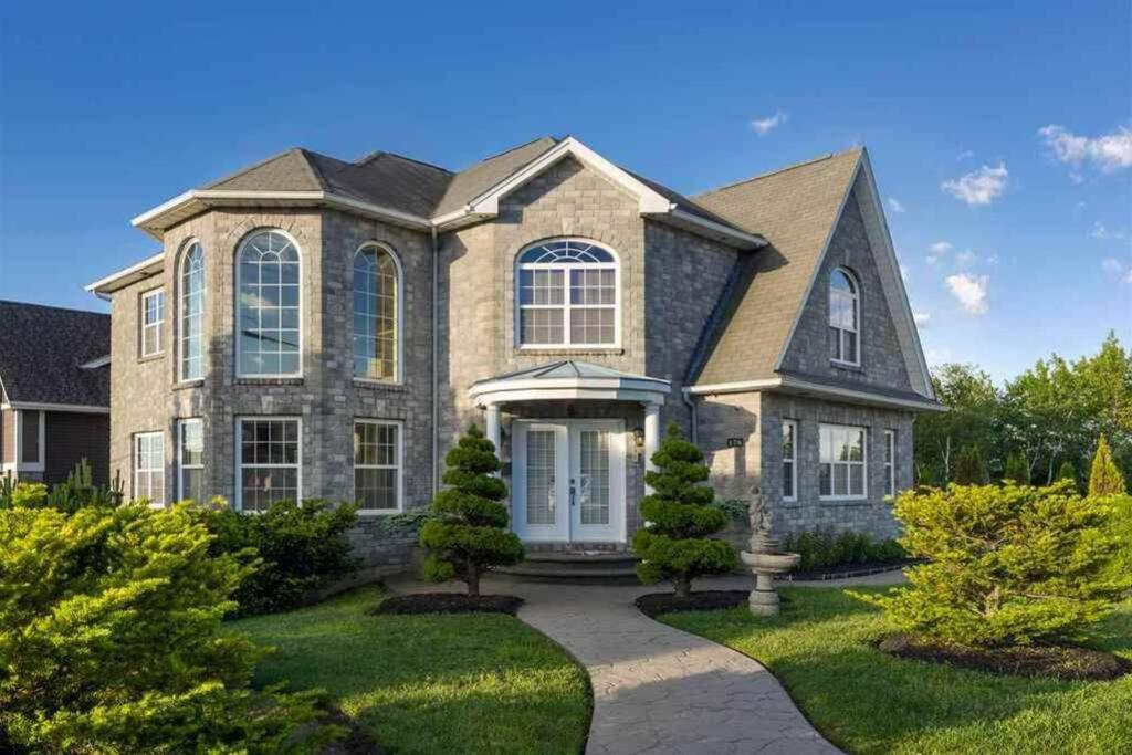 a large brick house with a driveway at Beautiful and Peaceful Home in Halifax