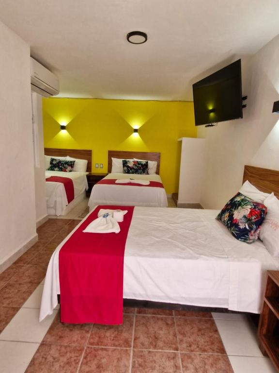 Postel nebo postele na pokoji v ubytování Hotel Capri Playa a una calle de la Playa Regatas