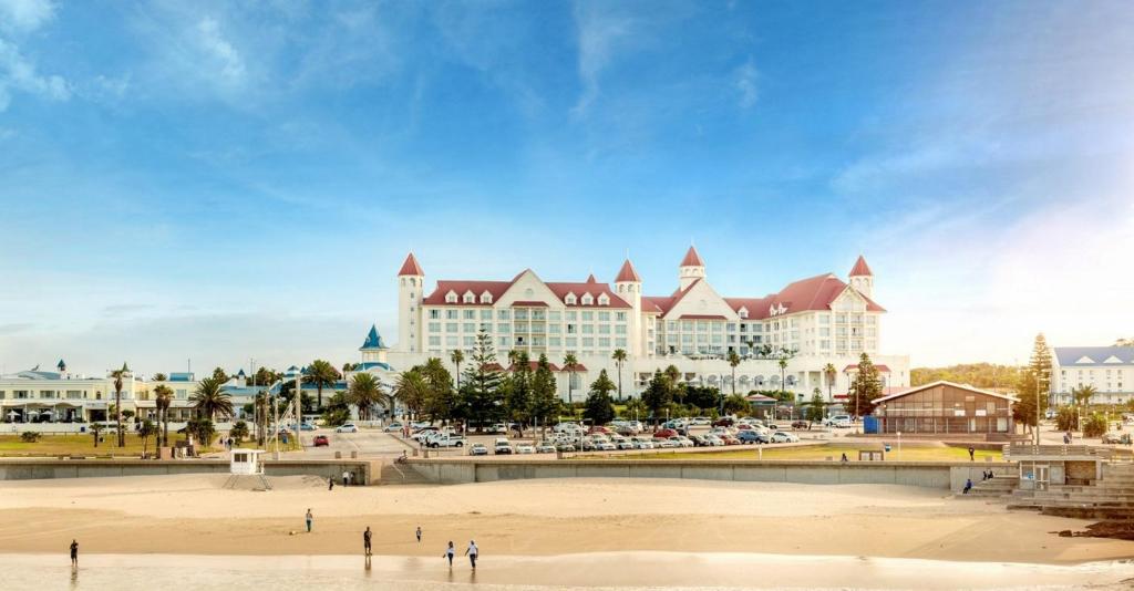 a large resort with a beach in front of it at The Boardwalk Hotel, Convention Centre & Spa in Port Elizabeth