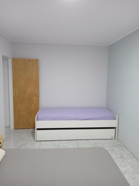 Ένα ή περισσότερα κρεβάτια σε δωμάτιο στο DelSur dptos