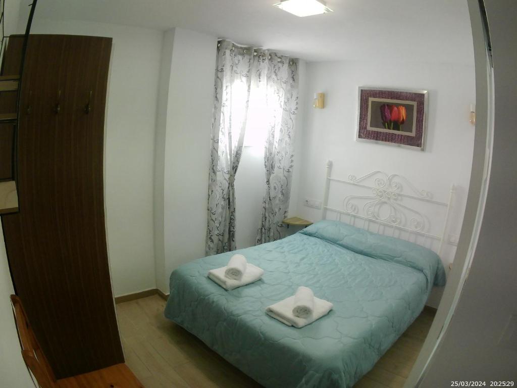 Postel nebo postele na pokoji v ubytování Miguel y Rosa 2