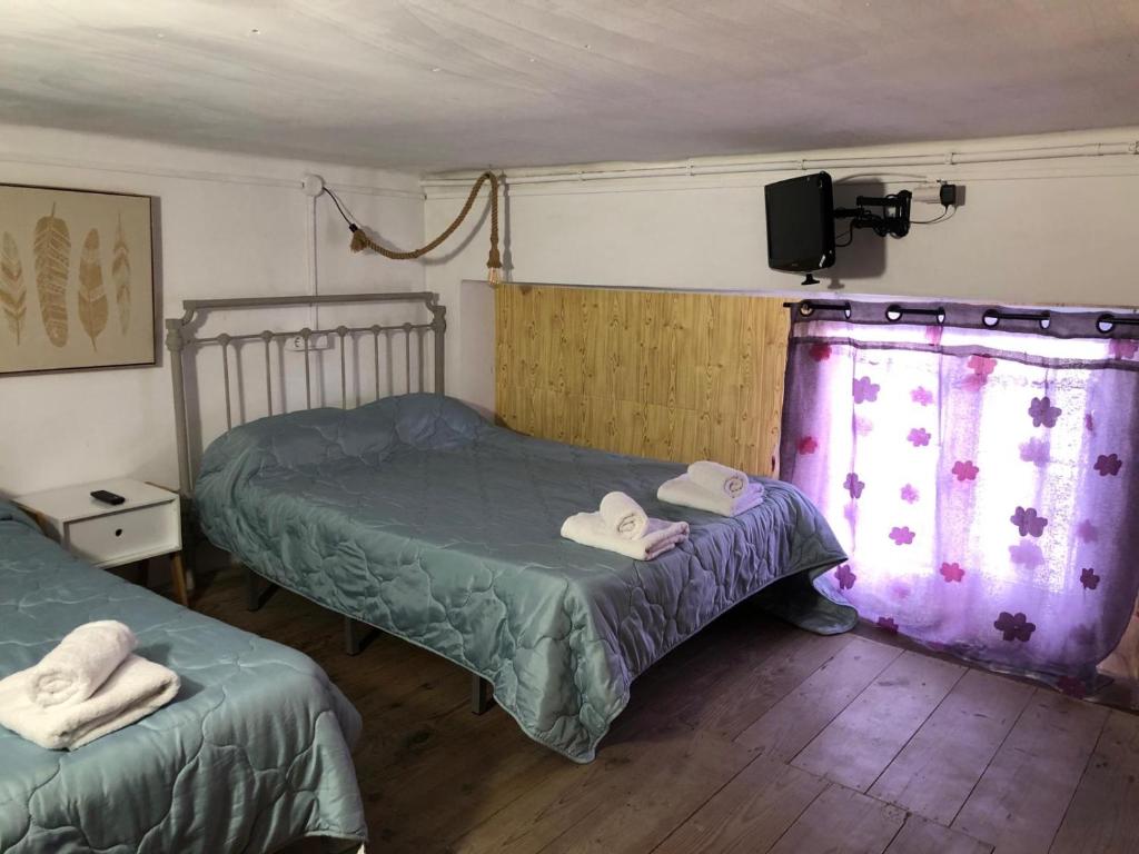 Postel nebo postele na pokoji v ubytování Miguel y Rosa 2