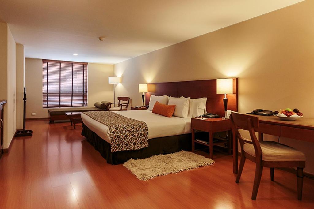 Postel nebo postele na pokoji v ubytování Hotel Estelar Suites Jones