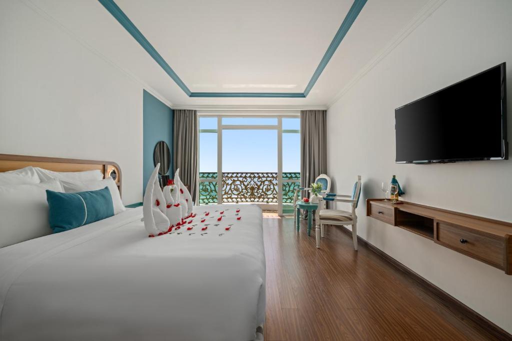 Ένα ή περισσότερα κρεβάτια σε δωμάτιο στο Paracel Beach Hotel