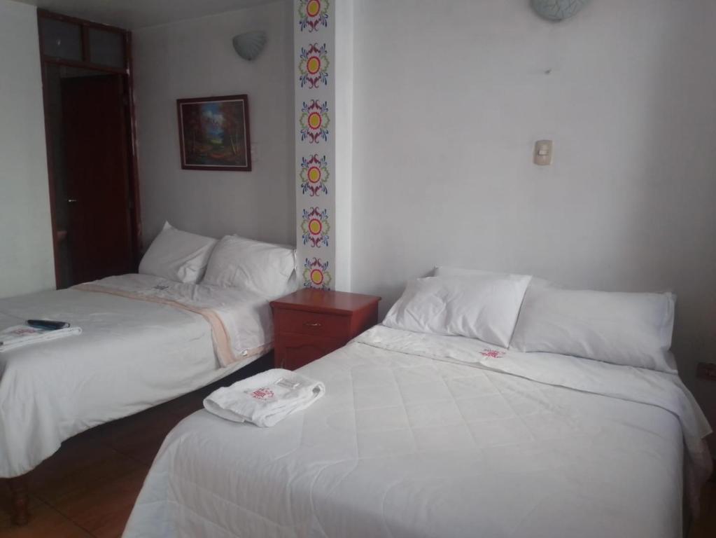 Postel nebo postele na pokoji v ubytování El Balcon Hostal