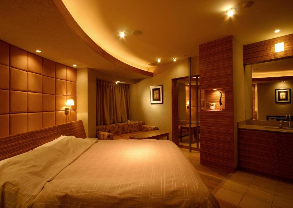 Postel nebo postele na pokoji v ubytování HOTEL ｍ