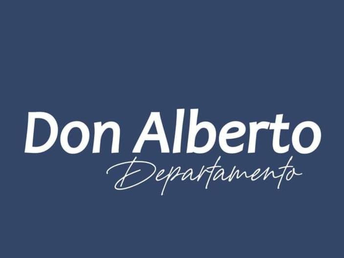 una señal con las palabras don albertino desplazamiento en Departamento DON ALBERTO en El Calafate