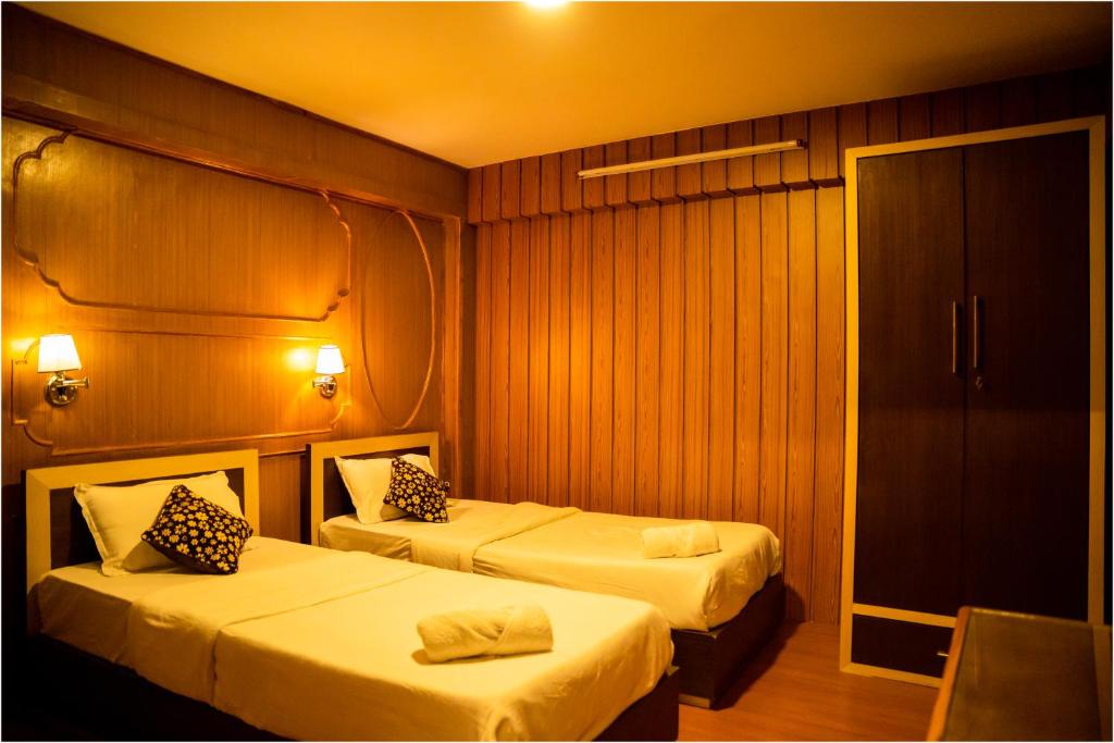 Postel nebo postele na pokoji v ubytování Nag Pukhu Guest House