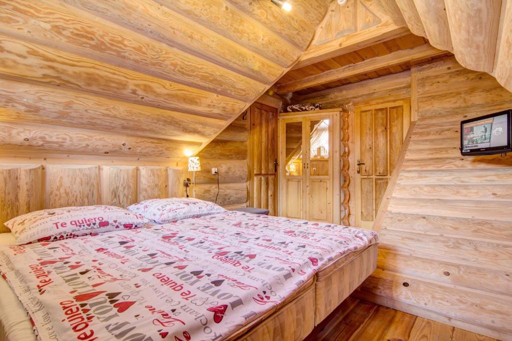 Posteľ alebo postele v izbe v ubytovaní Domki Tatra Lux Zakopane