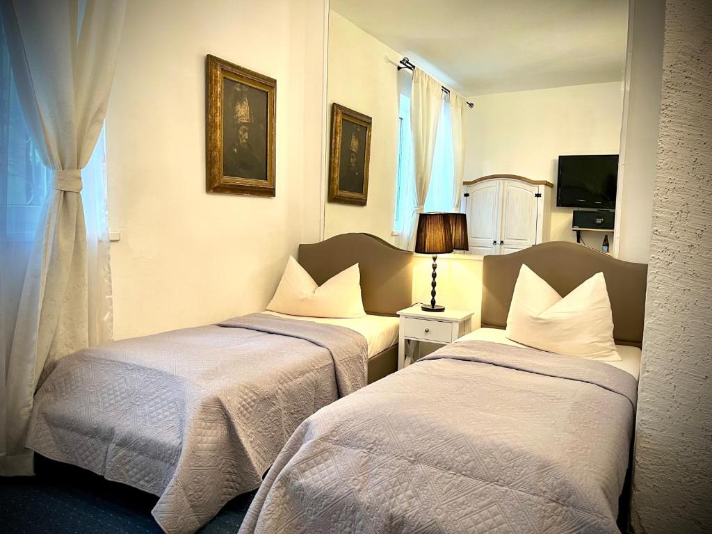 Postel nebo postele na pokoji v ubytování Hotel Mariahilf München