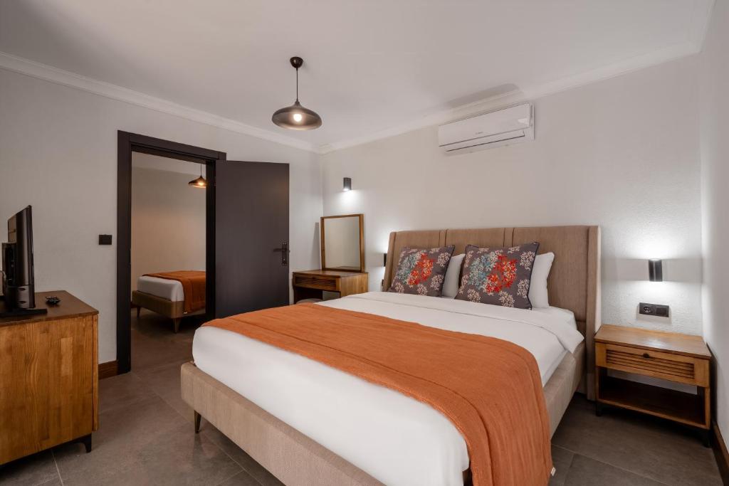 A bed or beds in a room at Hotel Centro Bodrum