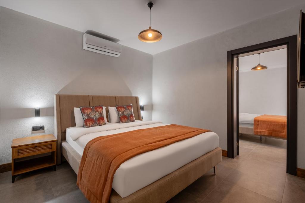A bed or beds in a room at Hotel Centro Bodrum