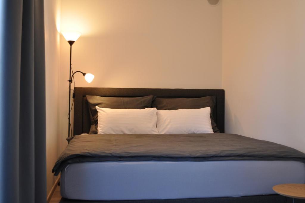 Кровать или кровати в номере Apartment Timo Bešeň 209