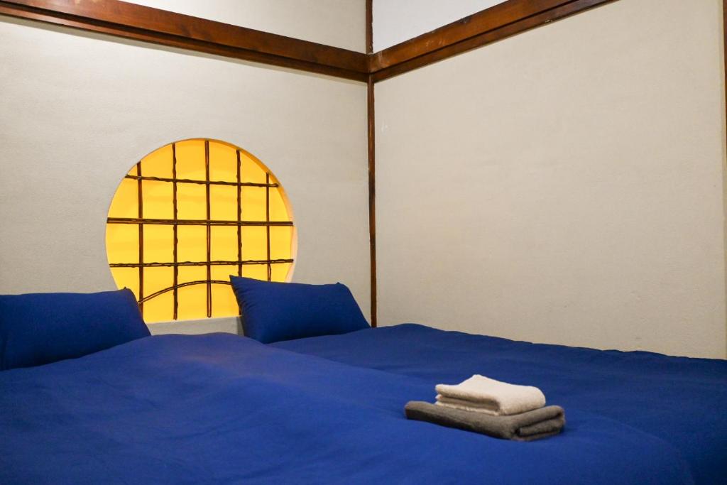 Postel nebo postele na pokoji v ubytování SYMPOSION Locanda