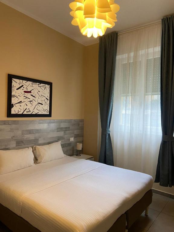 Posteľ alebo postele v izbe v ubytovaní PARADISE INN