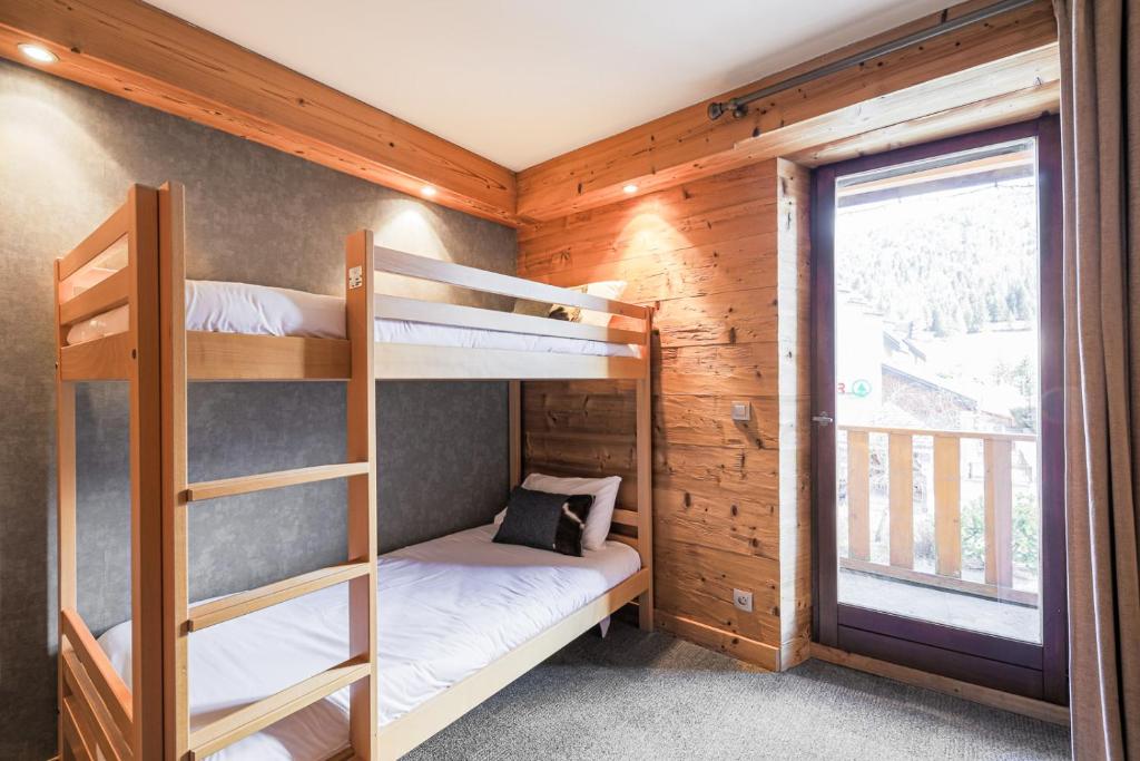 Postel nebo postele na pokoji v ubytování Hôtel et Spa les Clarines