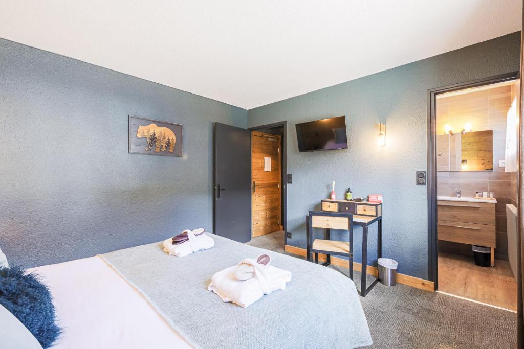 Postel nebo postele na pokoji v ubytování Hôtel et Spa les Clarines