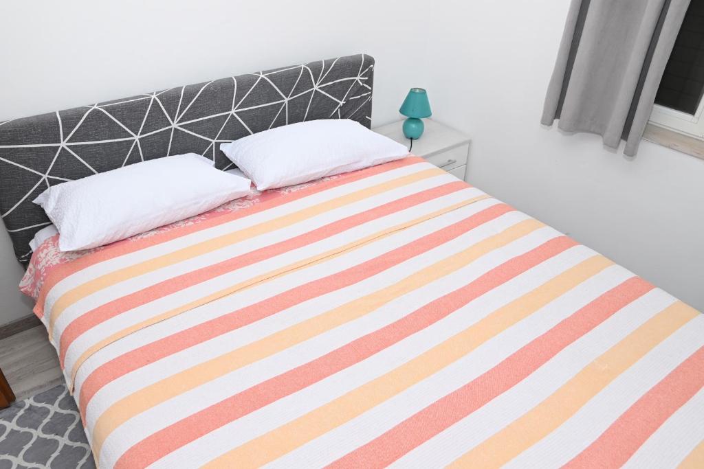 Posteľ alebo postele v izbe v ubytovaní Apartment Oscar