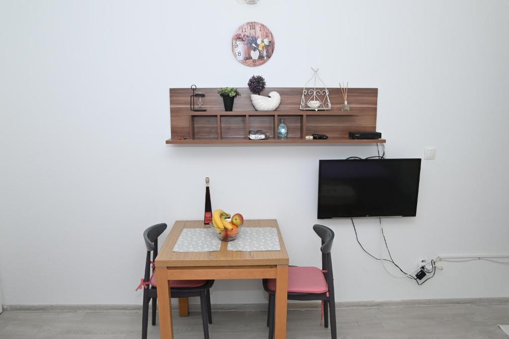 Televízia a/alebo spoločenská miestnosť v ubytovaní Apartment Oscar