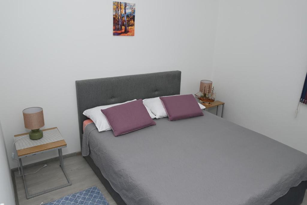 Posteľ alebo postele v izbe v ubytovaní Apartment Oscar