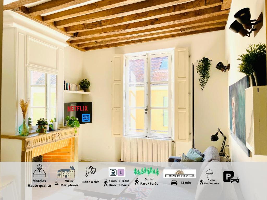 a living room with white walls and wooden ceilings at Studio de charme bien equipé - Matelas de qualité - Proche de la gare et de Versailles in Marly-le-Roi