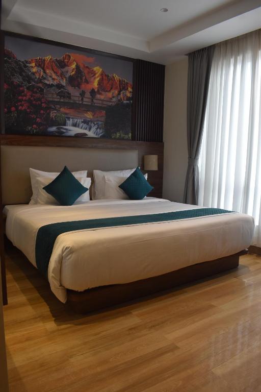 Postel nebo postele na pokoji v ubytování Dees Boutique Hotel