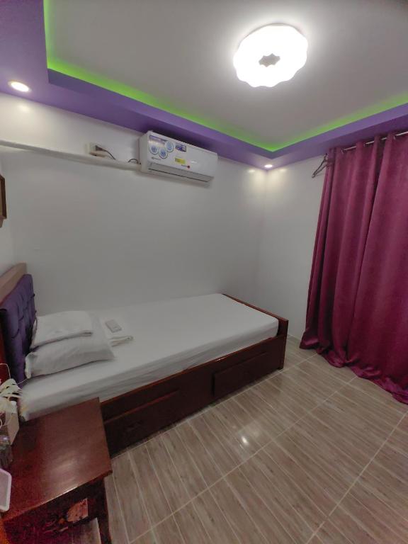 Postel nebo postele na pokoji v ubytování Homelux Transient House