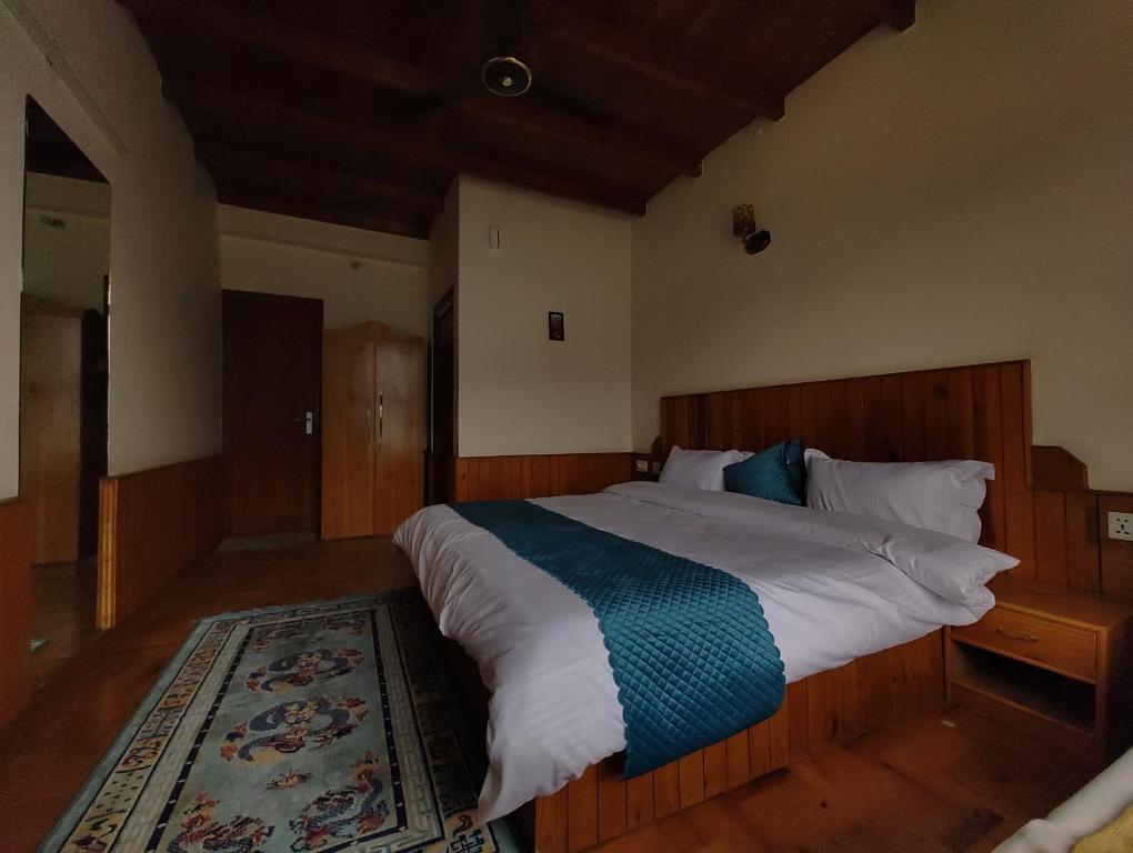 Postel nebo postele na pokoji v ubytování TSUKIMI Homestay, Naggar, Manali