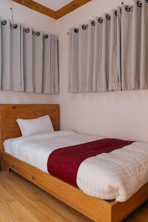 Postel nebo postele na pokoji v ubytování Bardali Restro and Residency
