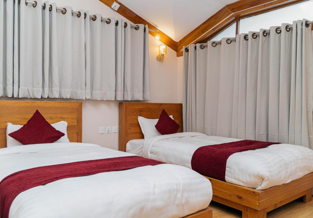 Postel nebo postele na pokoji v ubytování Bardali Restro and Residency