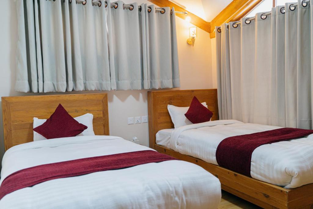 Postel nebo postele na pokoji v ubytování Bardali Restro and Residency