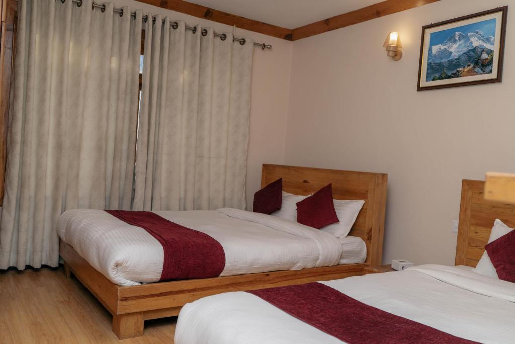 Postel nebo postele na pokoji v ubytování Bardali Restro and Residency