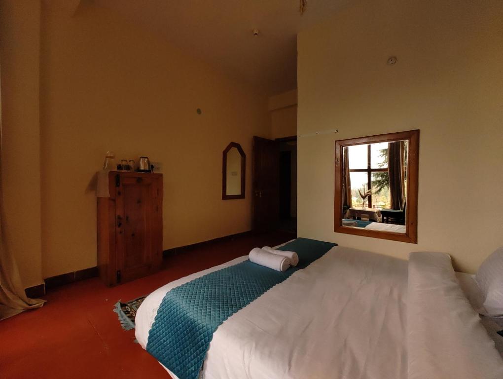 Postel nebo postele na pokoji v ubytování TSUKIMI Homestay, Naggar, Manali