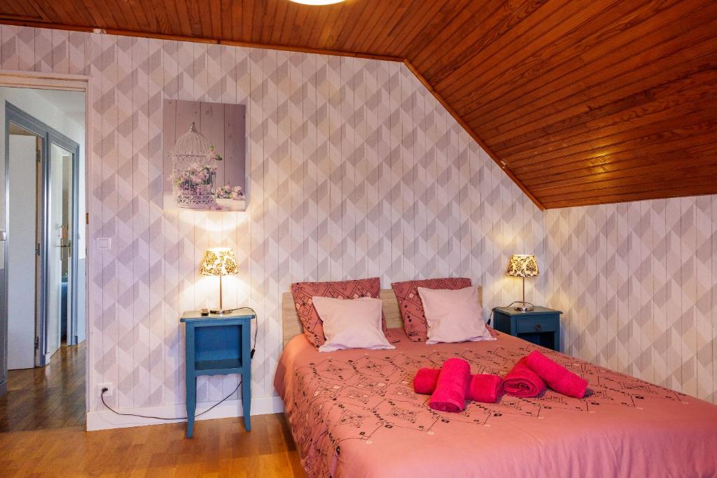 Postel nebo postele na pokoji v ubytování ARVEIL