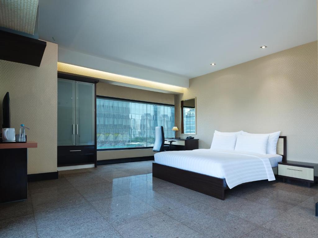 Ένα ή περισσότερα κρεβάτια σε δωμάτιο στο Manhattan Hotel Jakarta