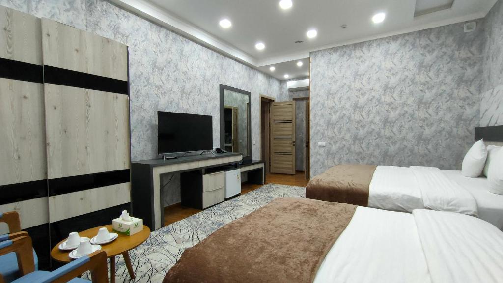 Postel nebo postele na pokoji v ubytování Ada Hotel