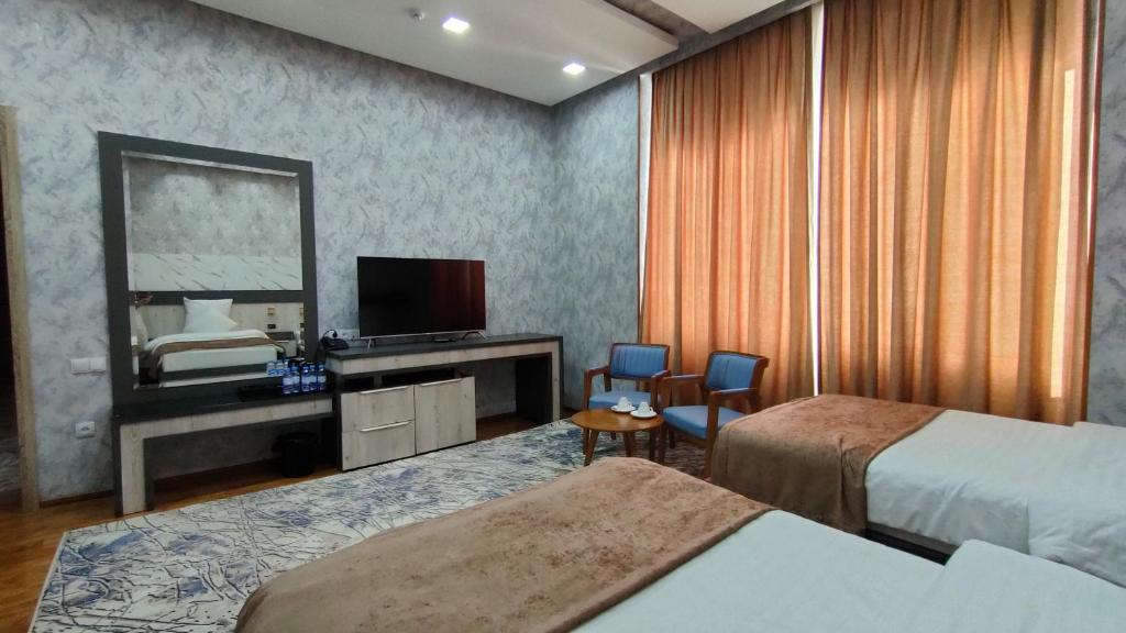 Postel nebo postele na pokoji v ubytování Ada Hotel